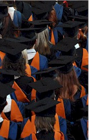 Graduands sat in row with just their hoods visible.