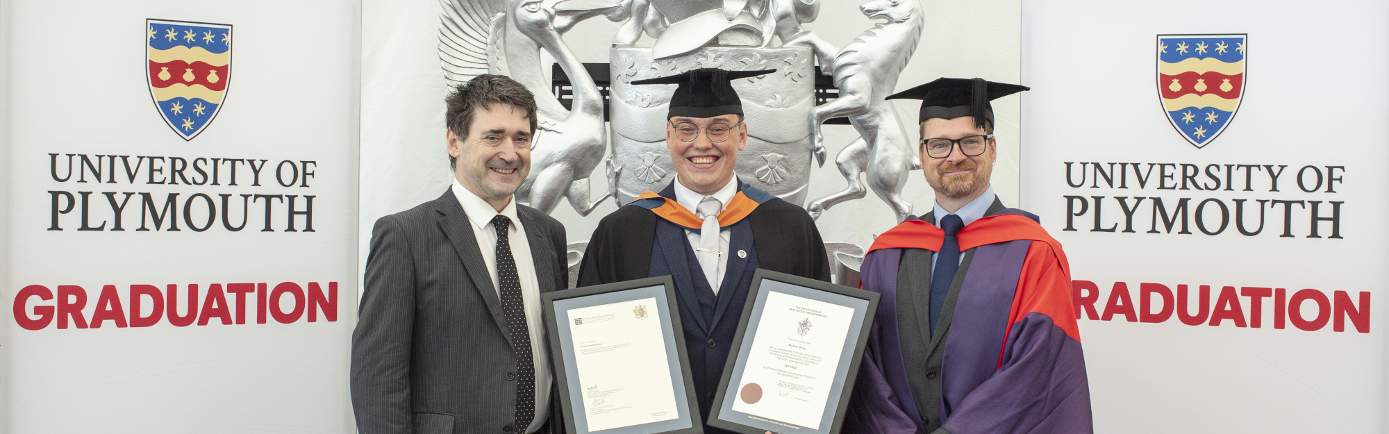 Michael Bruty (2023 Recipient) flanked by Alastair Revell (left) and Professor Alexander Belton (right).