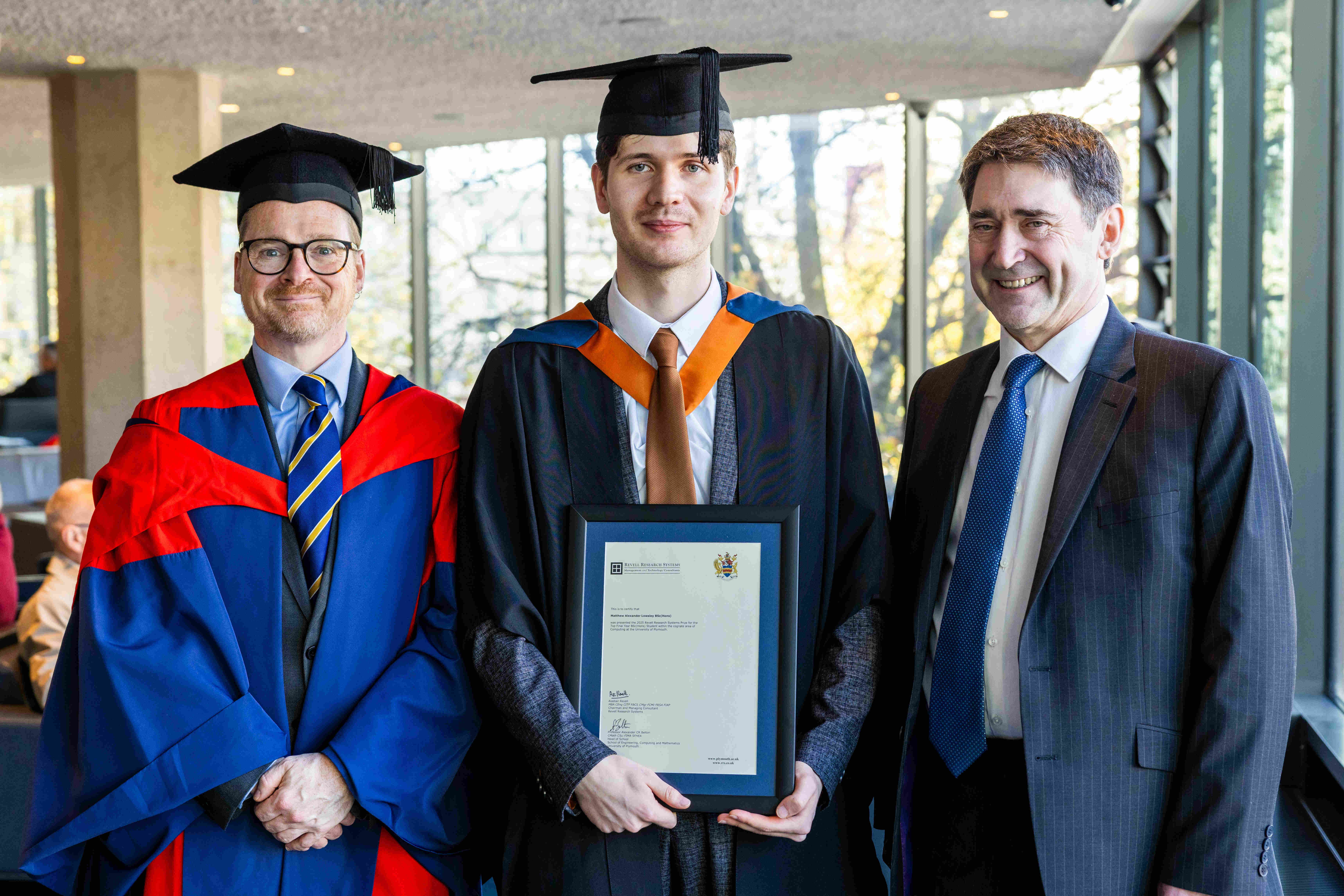 Matthew Lowsley receiving the Revell Research Systems Prize at the University of Plymouth in 2025 
                    with Professor Alexander Belton and Alastair Revell.