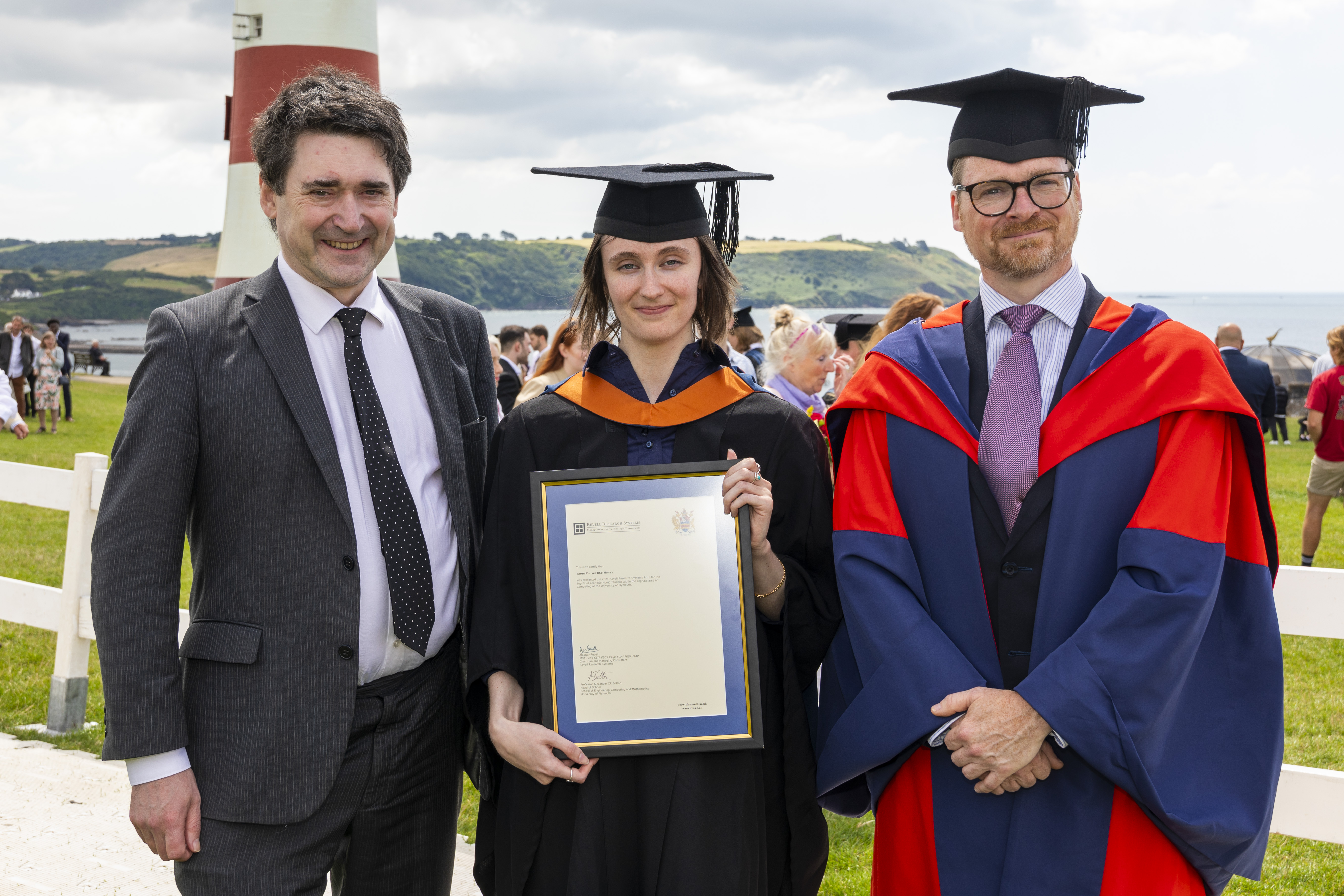 Tarren Collyer with Alastair Revell (left) and Professor Alexander Belton (right) on Plymouth Hoe in 2024.