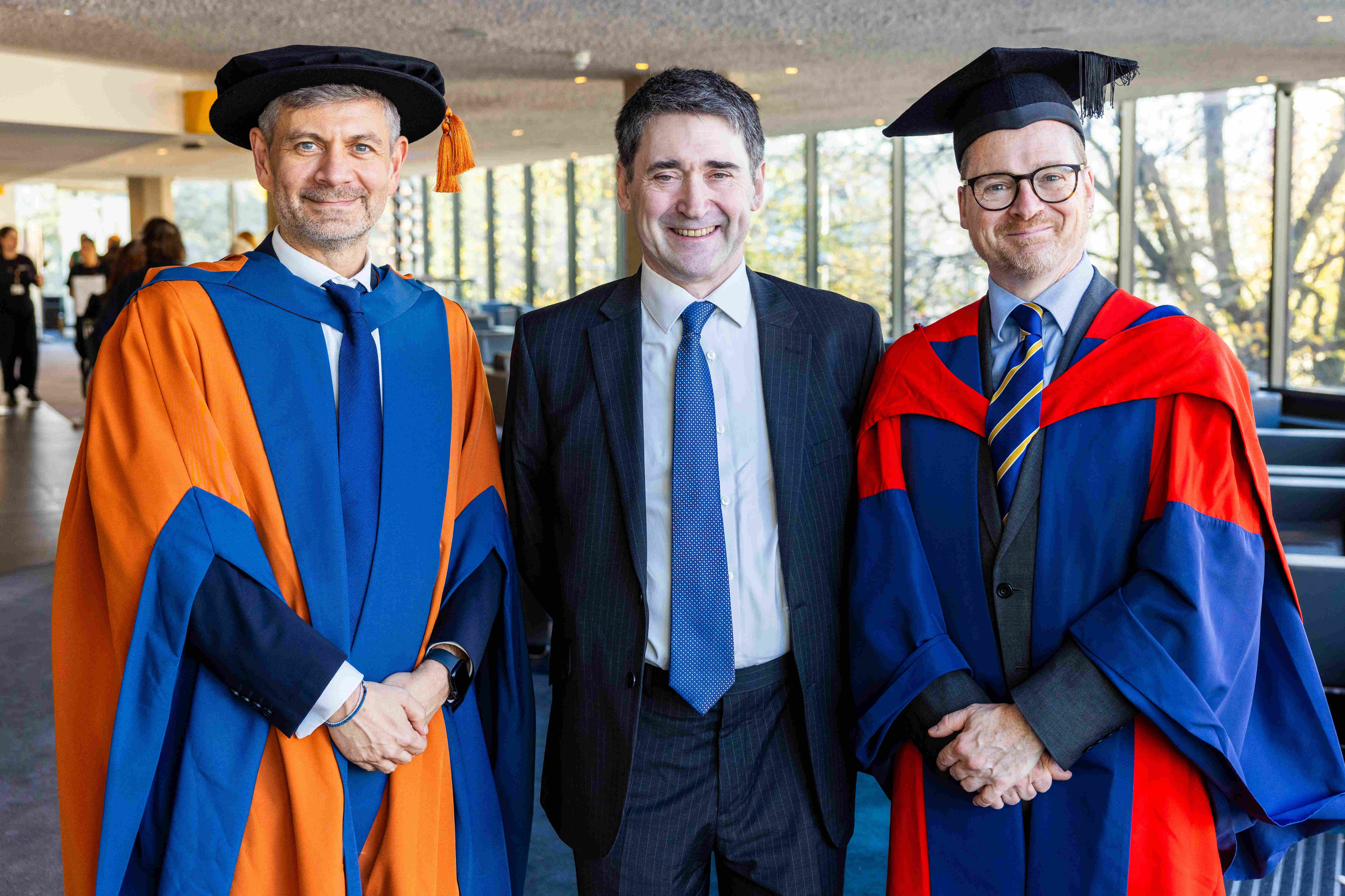 Professor Bogdan Ghita (left) and Professor Alexander Belton (right) with Alastair Revell in 2025.