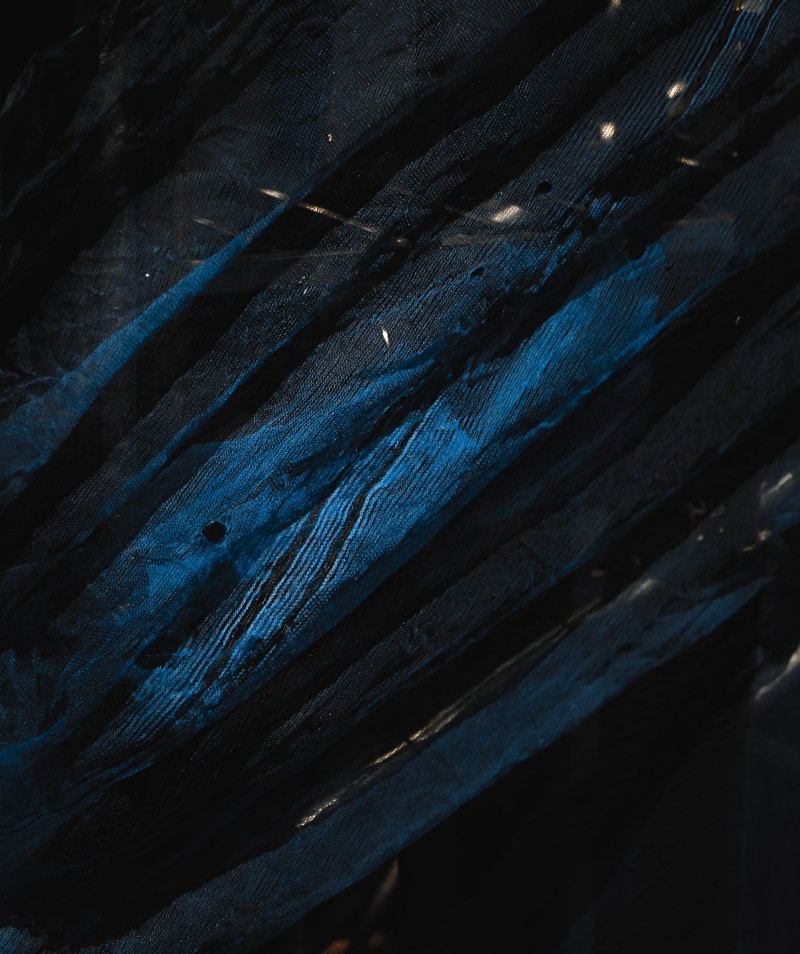 A predomonantly dark blue abstract image.