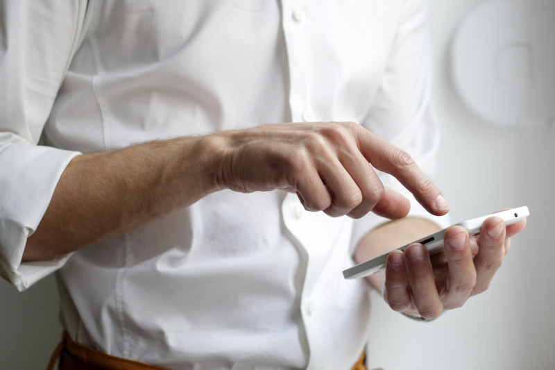 Man Using Mobile Phone.